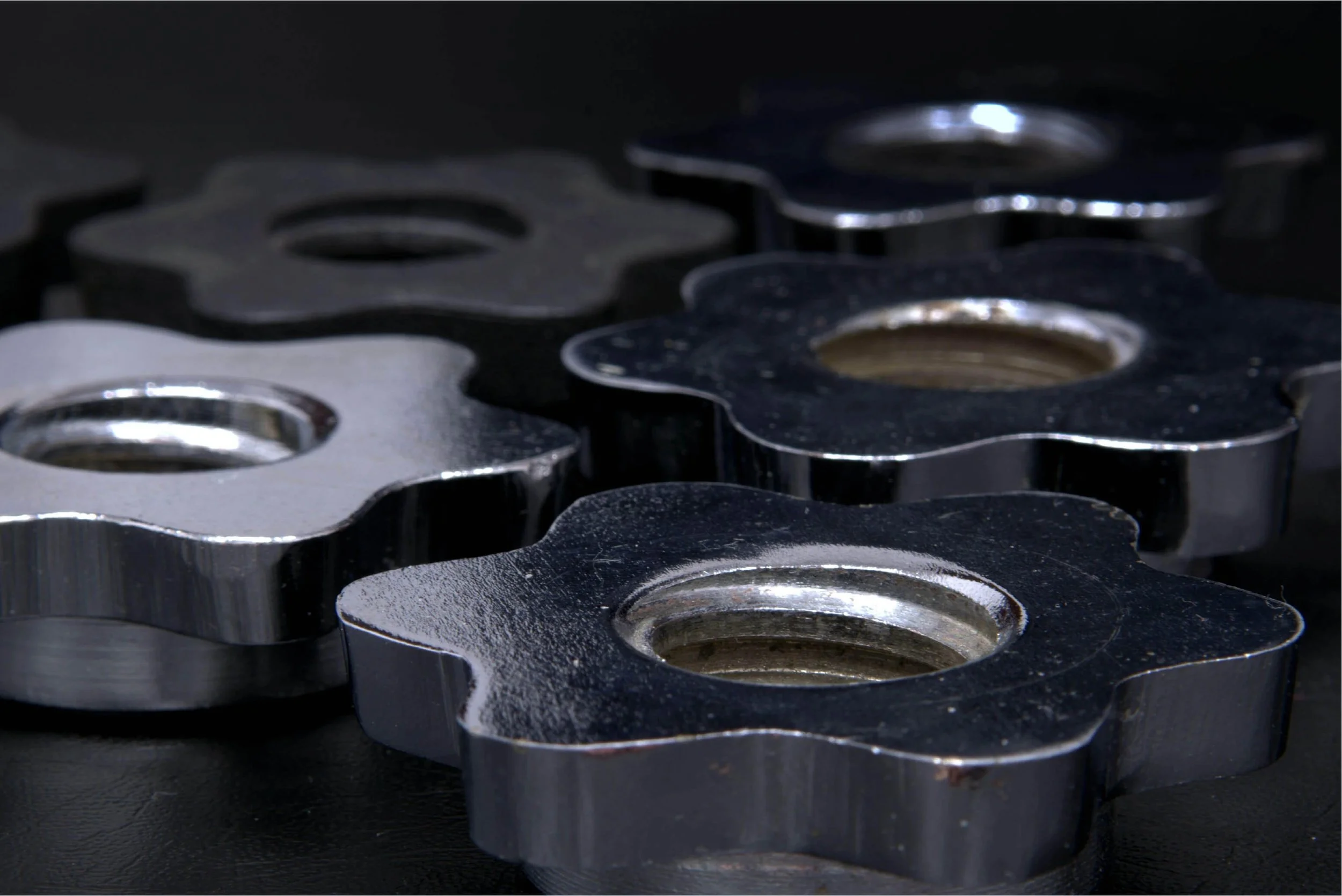 Close-up of precision metal nuts and bolts representing Saphirion’s manufacturing workflows